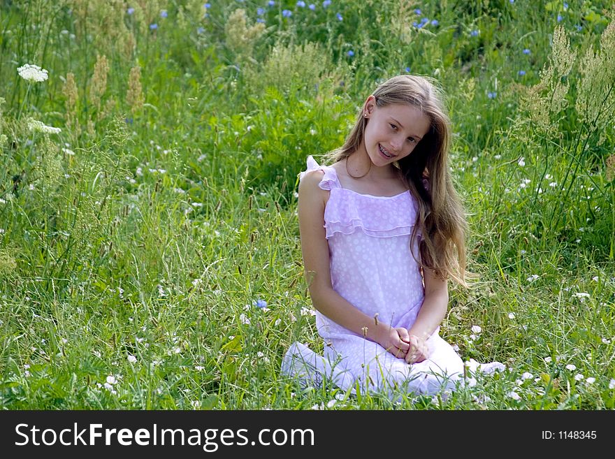 Beauty girl siting on grass