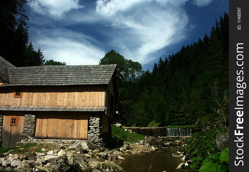 Mills and Sawmill in valley. Mills and Sawmill in valley