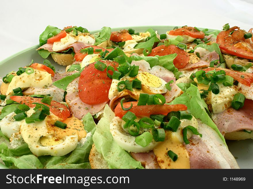 View of several sandwiches with meat and vegetables. View of several sandwiches with meat and vegetables