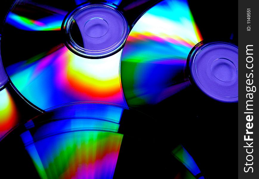 Photo of cds with light refecting off of them. Photo of cds with light refecting off of them
