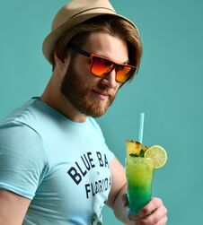 Young Man In Hat Drinking Margarita Cocktail Drink Juice Happy Looking At Camera Royalty Free Stock Photos