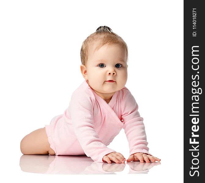 8 month infant child baby girl toddler lying in pink shirt isolated on a white background. 8 month infant child baby girl toddler lying in pink shirt isolated on a white background