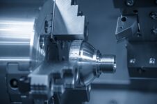 The CNC Lathe Machine Cutting Thread Stock Images The CNC Lathe Machine Cutting Thread Stock Images