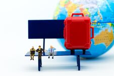 Miniature People : Businessman Sitting On Chair And Have A Red Suitcase, World Map For Background. Image Use For Travel, Business Stock Photos