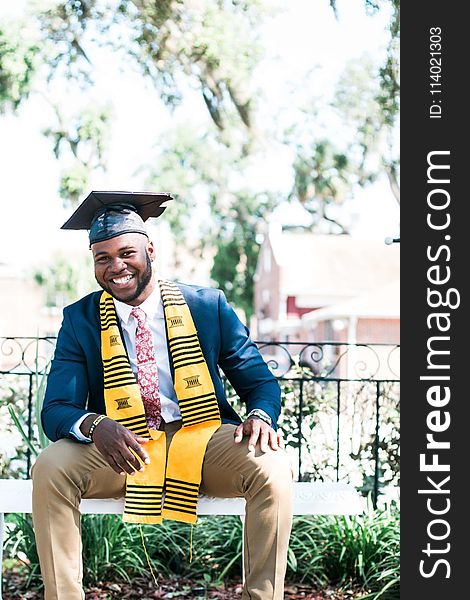 Photo of Man Wearing Graduation Cap