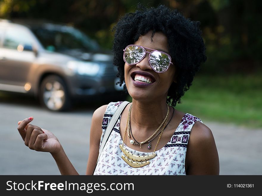 Woman Wearing Pink-framed Aviator Sunglasses