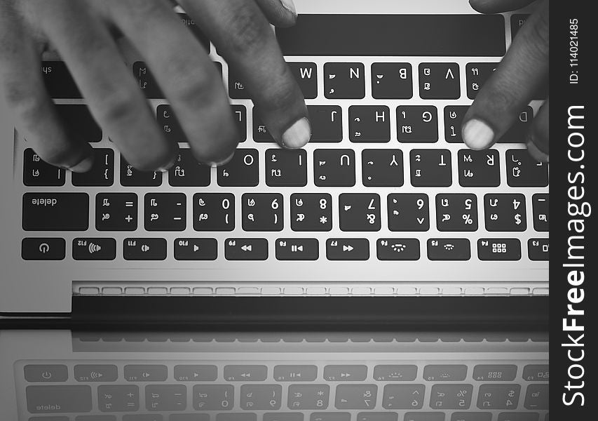 Person&#x27;s Hand on Computer Keyboard