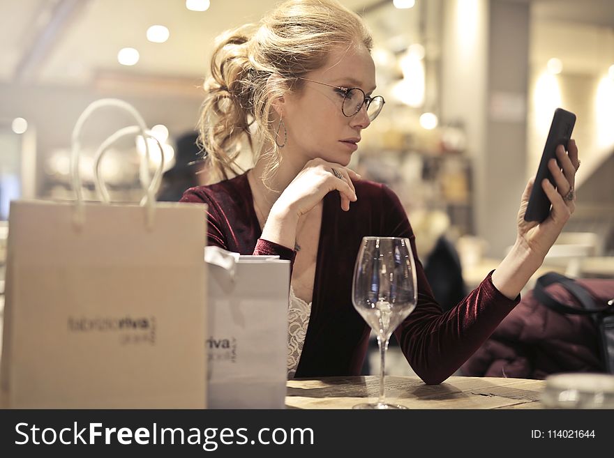 Photo of Woman Holding Her Phone