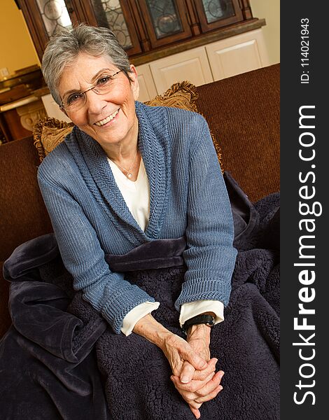 Confident mature older woman at home.