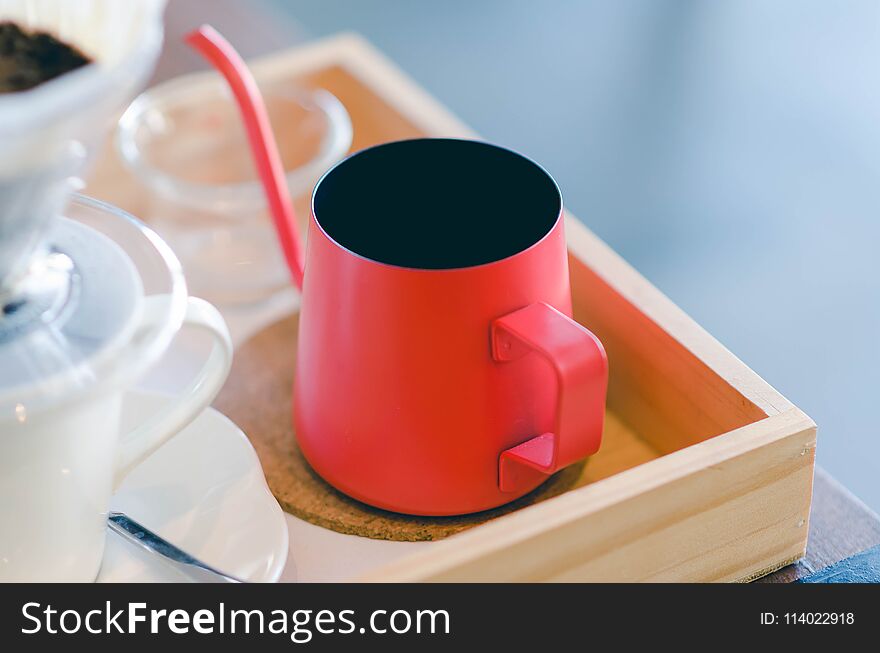 Close up red kettle with coffee dripping. Still life photography