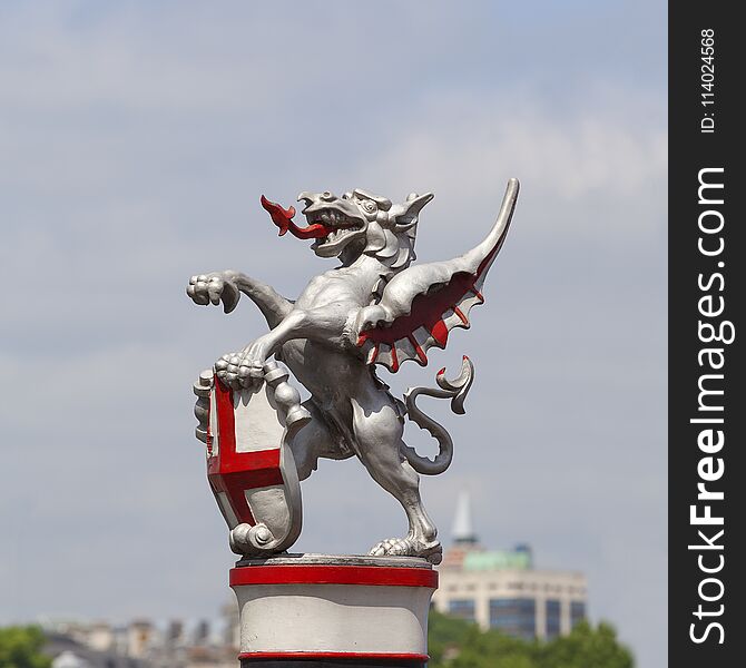 Coat of arms of the City of London, city border marker: single iron dragon holding a shield, London, United Kingdom