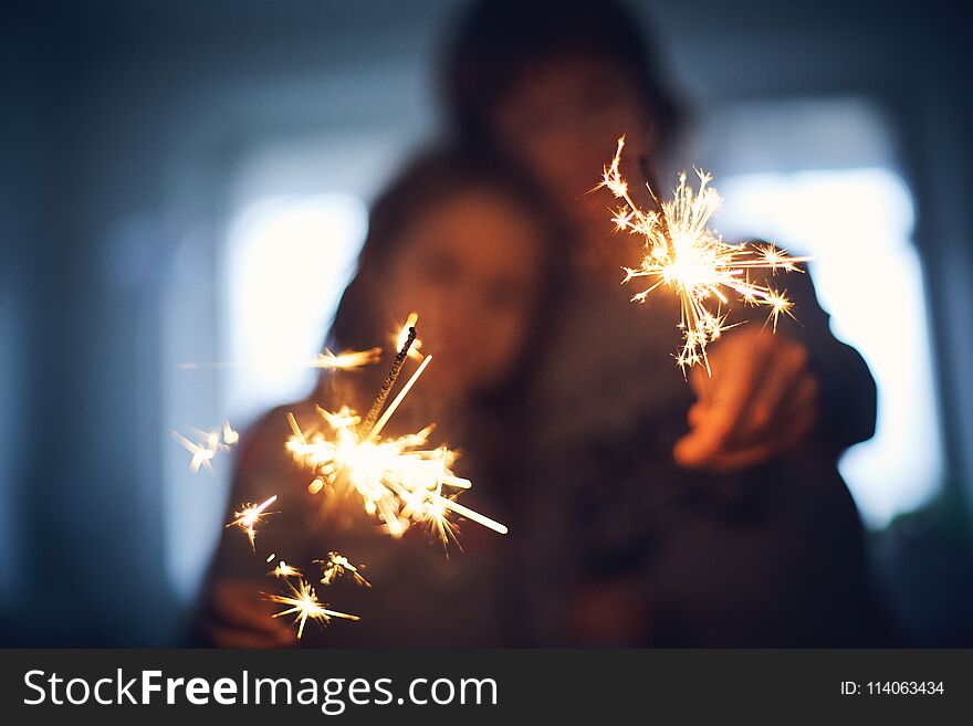 Children with Bengal lights. focus on the lights