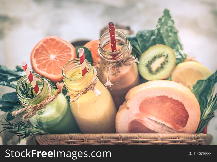 Healthy food fresh juice in bottles and fruits on a beautiful background, the concept of a healthy lifestyle, summer and fresh food. Healthy food fresh juice in bottles and fruits on a beautiful background, the concept of a healthy lifestyle, summer and fresh food