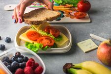 Mother Giving Healthy Lunch For School In The Morning Stock Photos Mother Giving Healthy Lunch For School In The Morning Stock Photos