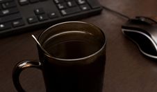 A Cup Of Coffee, A Mouse And A Keyboard Royalty Free Stock Photos