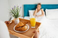 Man Bringing Breakfast To His Girlfriend In Bed Stock Photography Man Bringing Breakfast To His Girlfriend In Bed Stock Photography