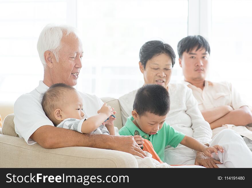 Candid of Asian family at home, multi generations people indoor lifestyle.