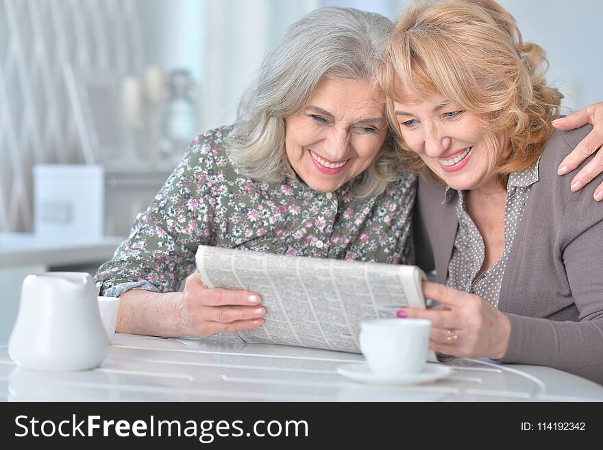 Portrait of a senior women with newspaper