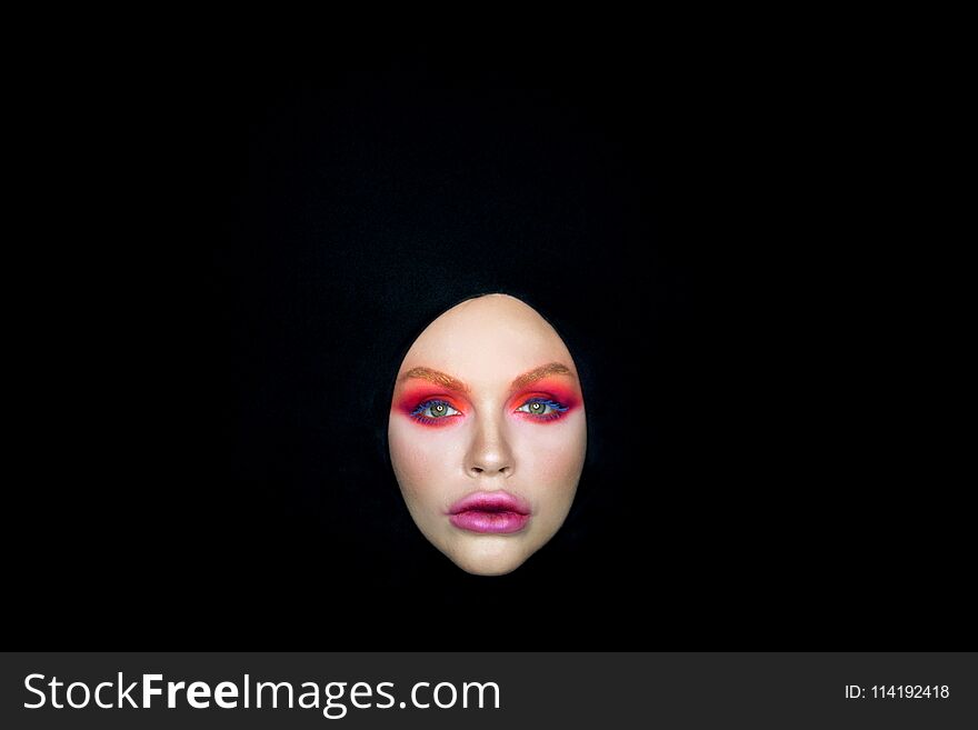 Womans eyes bright make-up veil black background
