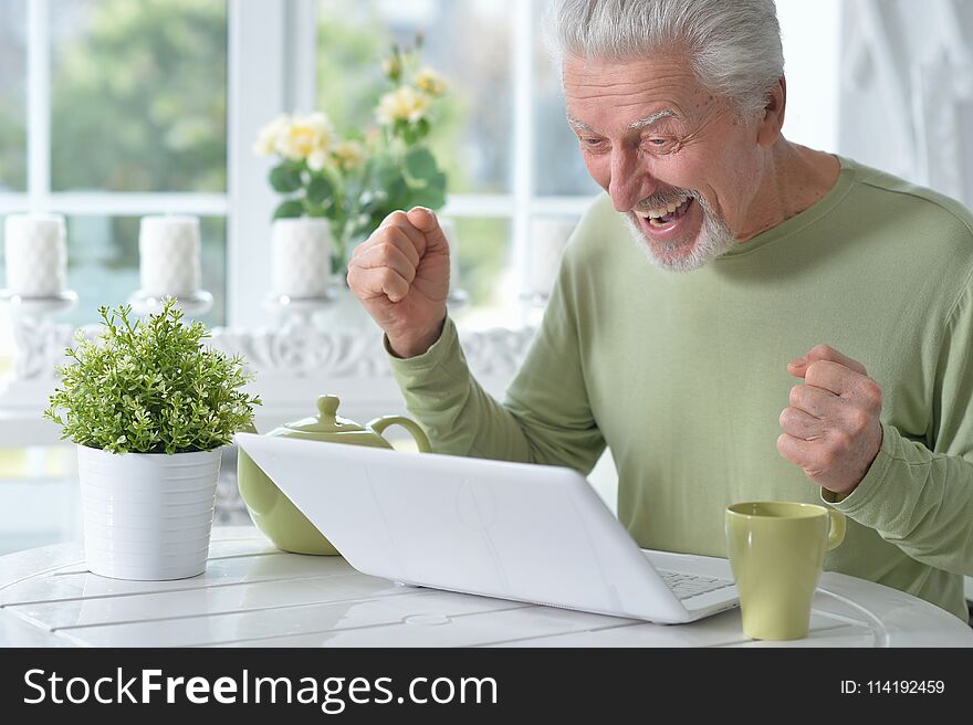 Senior Man Using Laptop