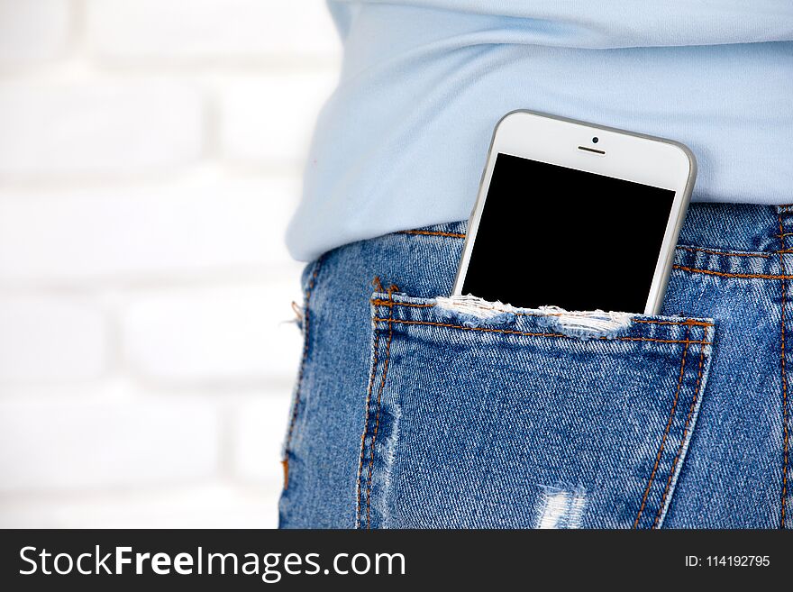 Close up of Smartphone with blank screen in jeans pocket. For add your text woith copy space.