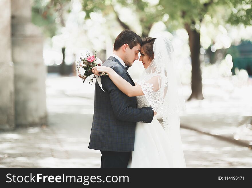 Gorgeous Wedding Couple Walking In The Old City Of Lviv