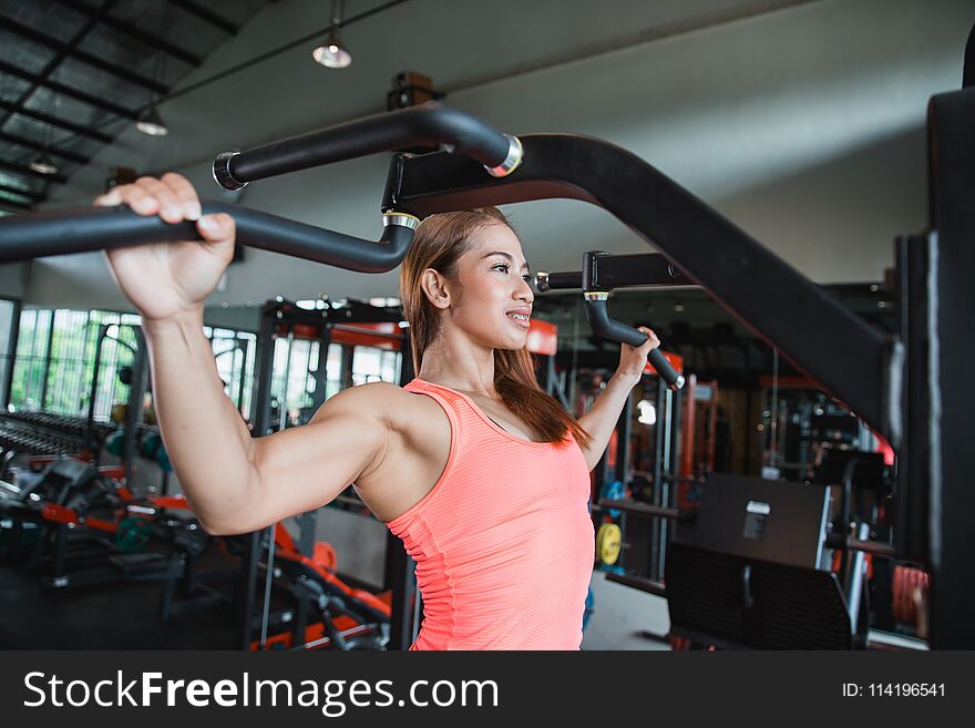 Close Up Young Adult Fitness Woman Doing Pull Ups