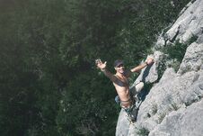 Man Rock Climber Climbs On The Cliff Royalty Free Stock Photo