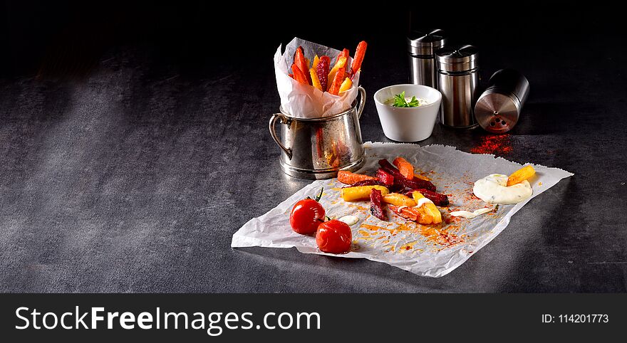 A vegetable French fries with herb quark and tomatoes