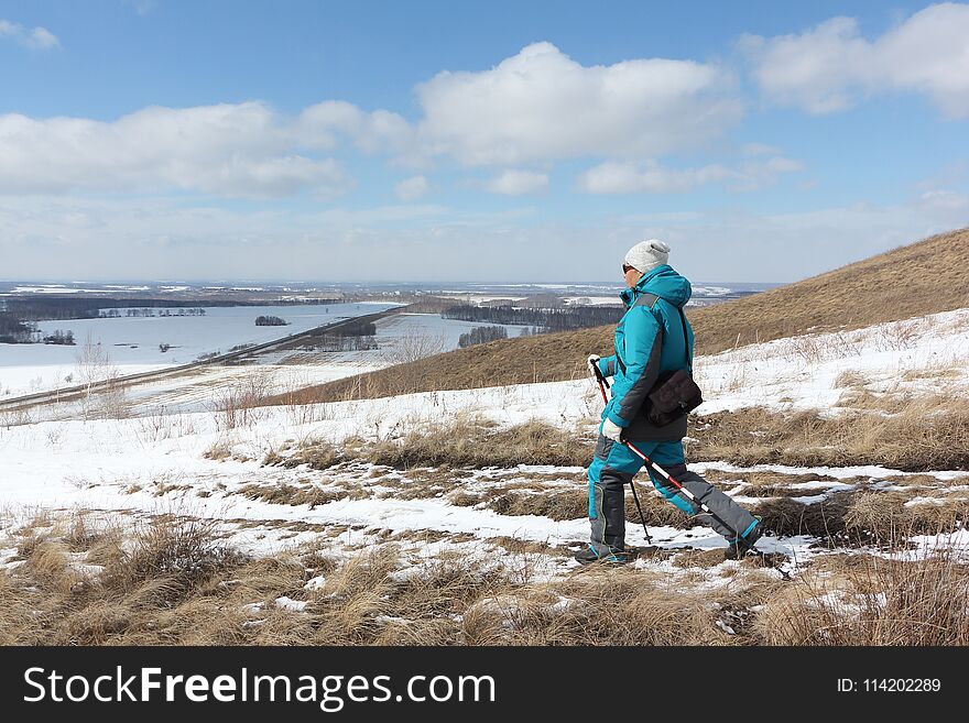 Nordic Walking - Adult Woman Descending From The Mountain