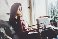 Attractive Young Businesswoman Wearing Casual Clothes And Working At Coworking Office.Female Using Contemporary Mobile Royalty Free Stock Photography Attractive Young Businesswoman Wearing Casual Clothes And Working At Coworking Office.Female Using Contemporary Mobile Royalty Free Stock Photography