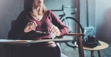 Handsome Young Girl Wearing Glasses Casual Clothes Holding Book Hands.Woman Blonde Sitting In Vintage Armchair Modern Royalty Free Stock Photo Handsome Young Girl Wearing Glasses Casual Clothes Holding Book Hands.Woman Blonde Sitting In Vintage Armchair Modern Royalty Free Stock Photo