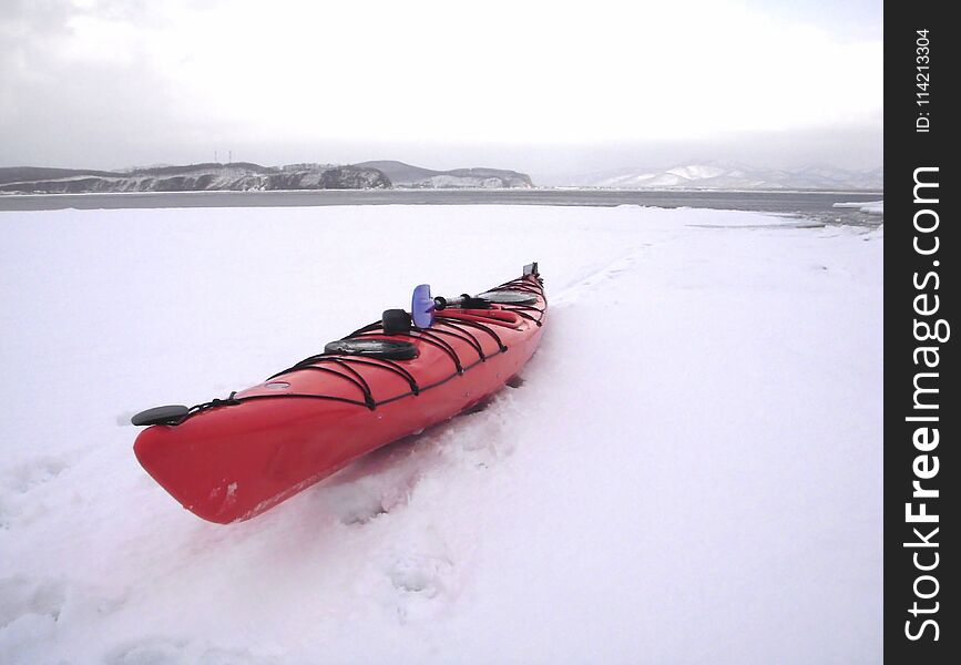 Red kayak on the snow. Red kayak on the snow.