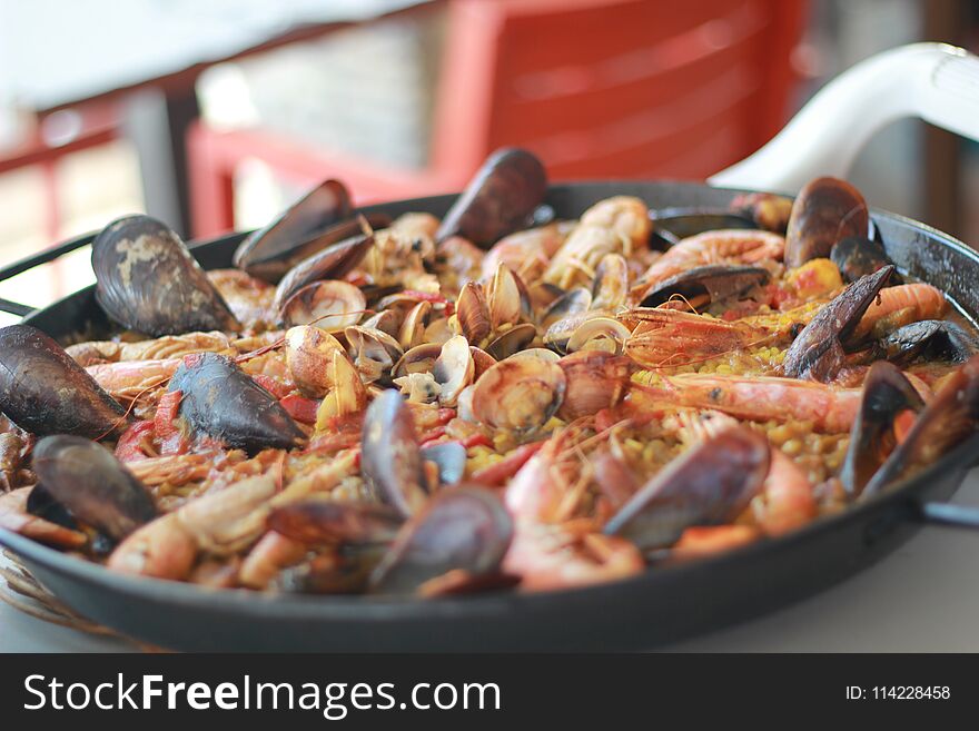 Seafood paella ready to served in the pan