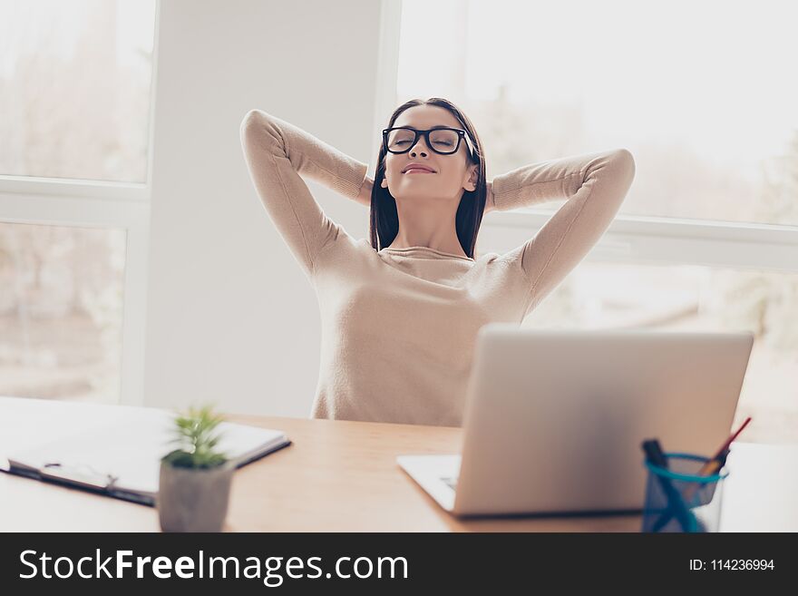 Leisure lifestyle comfort coziness concept. Portrait of peaceful calm beautiful harmonious elegant charming experienced carefree secretary holding head behind head casual clothes sitting light office