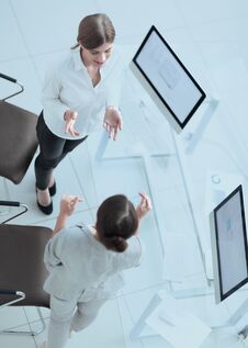 View From The Top.two Women Colleagues Discuss A Work Problem. Stock Photos