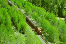 Freight Train Moves Through Canadian Rockies. Royalty Free Stock Photo