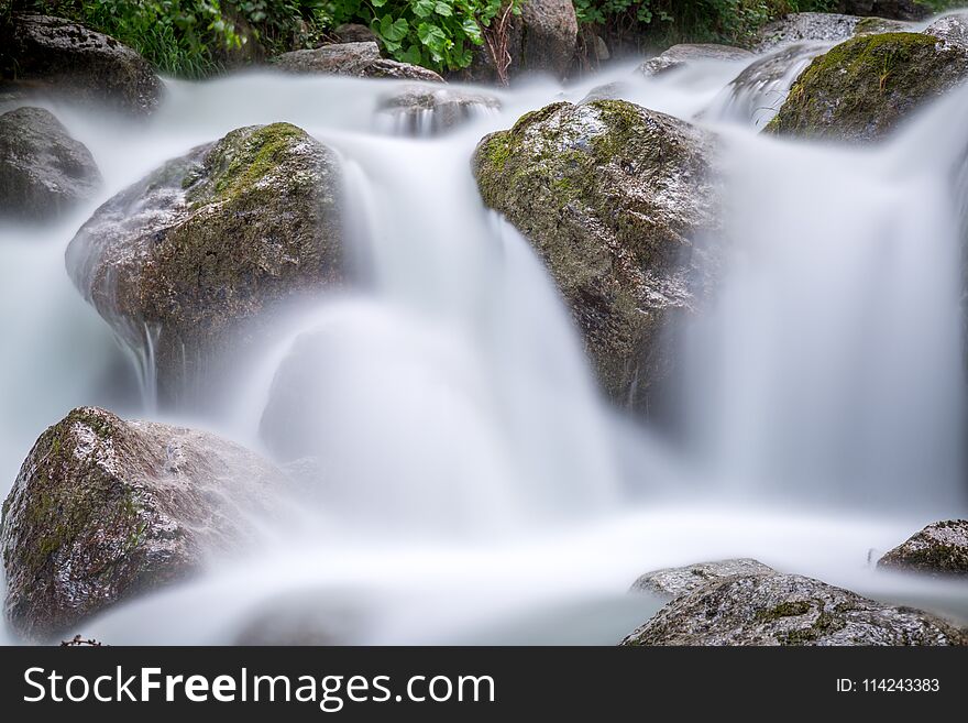 Long exposure of a torrent in the french alps near Chamonix Mont Blanc and the Italian border. Long exposure of a torrent in the french alps near Chamonix Mont Blanc and the Italian border.