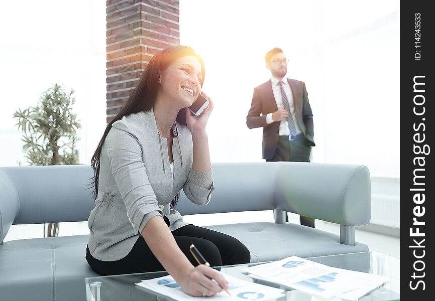 Woman assistant at the workplace in the office