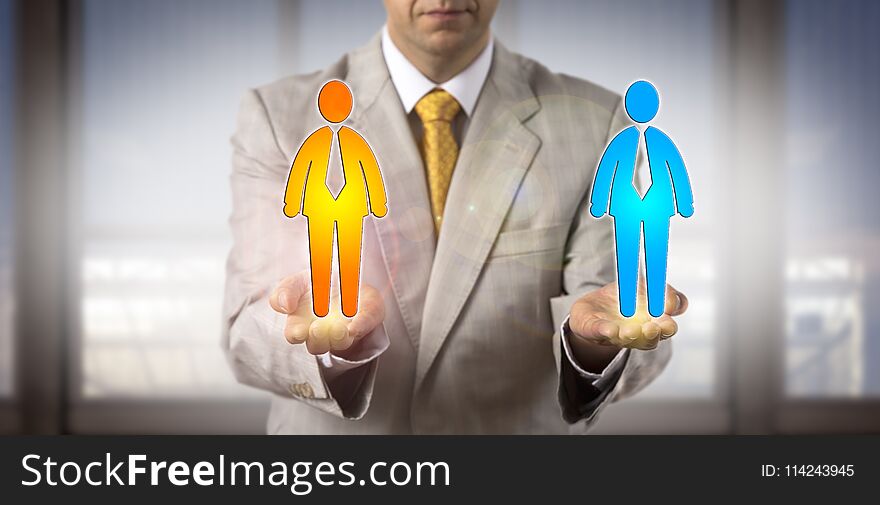 Unrecognizable recruitment agent is comparing two male candidate icons in the open palms of his hands held on same level. HR concept for equal opportunity, cultural diversity, succession planning. Unrecognizable recruitment agent is comparing two male candidate icons in the open palms of his hands held on same level. HR concept for equal opportunity, cultural diversity, succession planning.