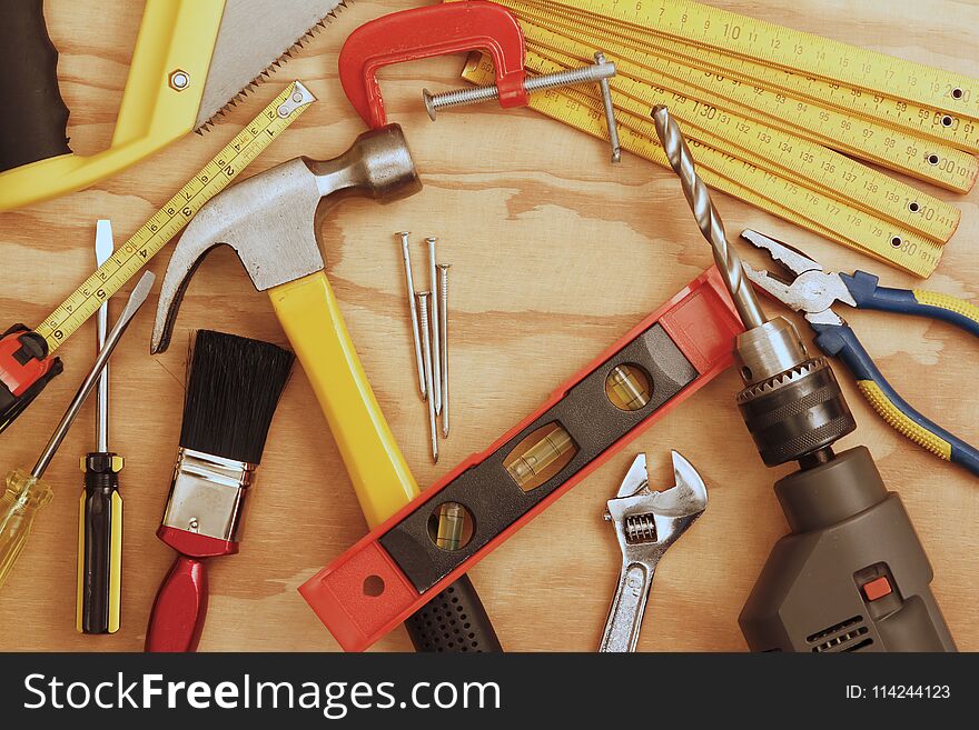 Assorted work tools on wood