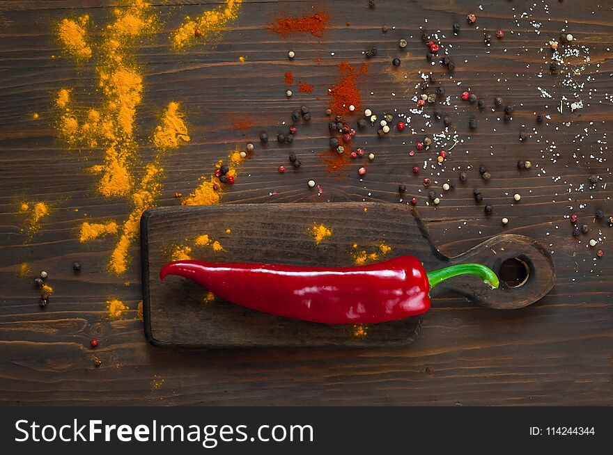 Red pepper on a dark background. Background with spices.spices. Top view. Close up. The concept of spices for cooking, copy space