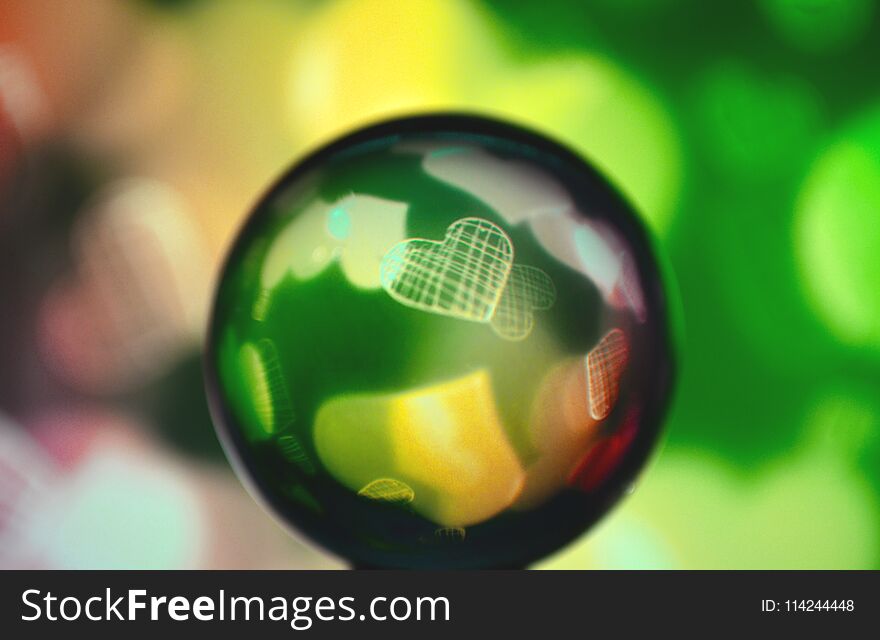 Colored glass sphere with heart