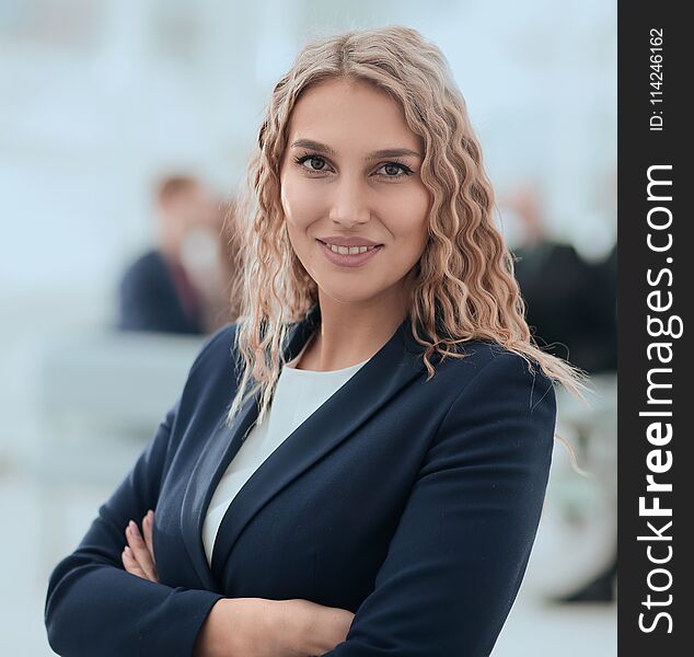 Closeup portrait of successful business woman on the background of the office. the business concept