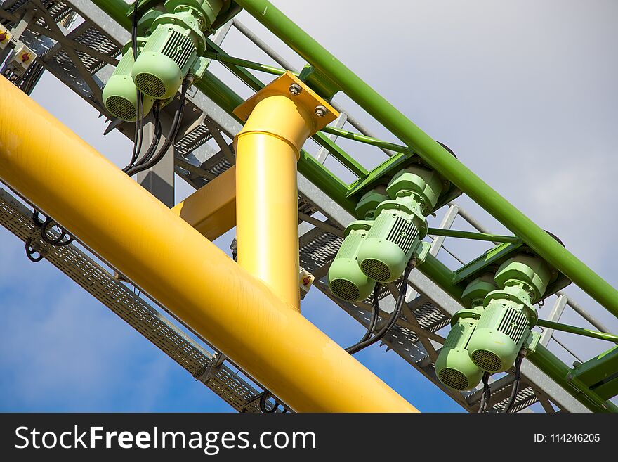 Rollercoaster Motor In Blue Cloudy Sky