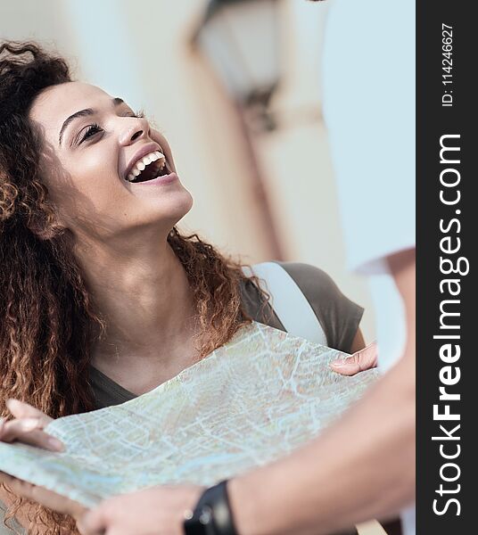 Female Tourist Exploring City While Holding Map