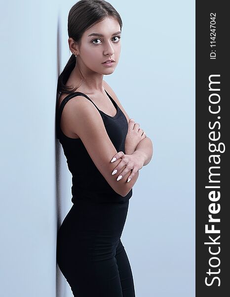 Modern young woman leaning on wall.photo with copy space