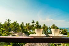 White Coffee Cup With Beautiful Paradise Island Sea And Beach Stock Image