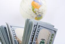 American Dollar Banknotes By The Side Of A Model Globe Royalty Free Stock Photography