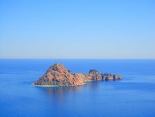 A Lonely Little Island, A Mountain In A Blue Ocean. Beautiful Blue Sky. Stock Image